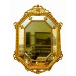 A very large cushion framed gilt Pier Mirror, with various mirror compartments, crested with a