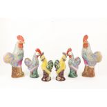 A pair of large Chinese Famille Rose porcelain Cockerel Figures, 36cms (14"), a pair of smaller