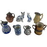 An embossed brown porcelain Jug, with hunting scene, an embossed Wine Jug, and another blue and