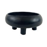 A rare South American black Pottery four legged Bowl, of circular ogee form, in the Pre-Columbian