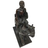 A heavy bronze Group, modelled as a Medieval Soldier holding a shield on horseback, 33cms (13"). (1)