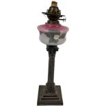 A good heavy 19th Century silver plated Table Lamp, with pink glass reservoir, on a Corinthian