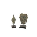 A small Thai Buddha Head, on square stand, 19cms (7 1/2"), together with a Thai bronze Buddha Mask