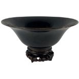 An early dark brown Chinese stoneware Bowl, of circular form on circular foot, 28cms (11") on