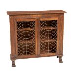 A late Regency period mahogany Side Cabinet, the oblong top with roped edge above a plain frieze and