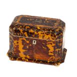 A 19th Century tortoishell two compartment Tea Caddy,  with ball feet. (1) Note: This item is