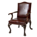 A very good quality 19th Century walnut Library Armchair, probably Irish, with padded hump back