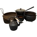 An antique metal Skillet Pot, a small similar ditto, a heavy metal oval Cooking Pot, a small metal