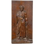 A 19th Century carved oak Relief, "St. Peter holding the Key and a Book," 54cms x 27cms (21" x 10