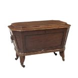 A George IV period mahogany sarcophagus shaped Cellaret, the hinged lift top, opening to reveal a