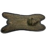 A bronze Model of a Grizzly Bear Rug, with hinged head mounted on a shaped wooden base, 32cms (12