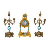 A late 19th Century gilt metal and porcelain rounded French Mantel Clock Garniture, the movement