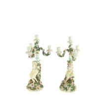 A pair of Sitzendorf flower encrusted porcelain Candelabra, c. 1900, each with three floral arms and