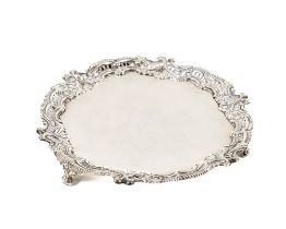 A heavy silver Card Tray, with pierced and cast border, London 1932, AP FP AR, on three winged