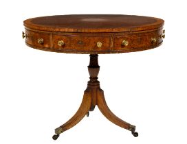 A good Regency style birds-eye-maple and rosewood banded Library Drum Table, with mock and two