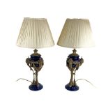 An attractive pair of brass mounted and dark blue porcelain Table Lamps, in the manner of Mathew