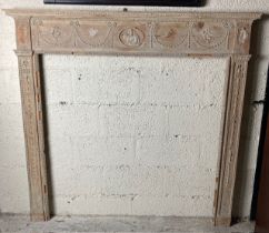 A 19th Century pine Fire Surround, the bead moulded shelf above a frieze with an oval relief with