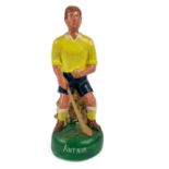G.A.A.: a hand painted plaster Figure of a hurler "Antrim,"  in crouched position with sliotar and