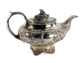 A William IV period silver Tea Service, London 1834 by G.H., the Teapot with embossed decoration