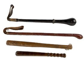A collection of leather and wooden Truncheons, of various design and size. (4)