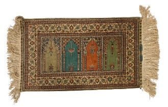 An attractive Middle Eastern Prayer Rug, the centre with four Arabesque coloured panels inside