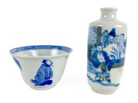 A small Chinese blue and white porcelain Tea Cup, with figures and plants, the interior with a
