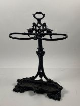 A Victorian cast iron Coalbrookdale Stick and Umbrella Stand, with carrying handle, above two