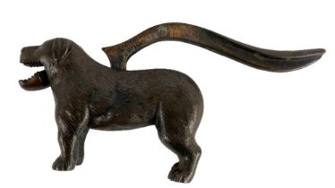 A heavy bronze Novelty Table Nut Cracker, modelled as a dog, with hinged tail mechanism. (1)