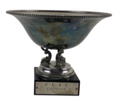 An attractive Sterling silver Trophy Bowl, with circular bead edge on a tri-dolphin support on