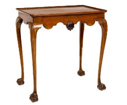 An attractive 19th Century Irish mahogany Silver Table, the moulded grey top over a shaped frieze