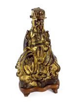 A very early Chinese bronze and gilt bronze Figure of a Supreme Deity, seated on associated carved