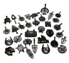 A large collection of approx. 30 cast iron Trifids and iron Stands, of variant design and sizes,