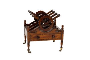 A William IV period mahogany Canterbury, with three X shaped divisions each with turned rails and