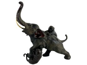 A Japanese bronze Model of an Elephant, being hunted by tigers, inset with tusks, approx. 32cms high