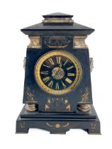 A late Victorian Egyptian Revival polished slate Mantle Clock, with bronze mask mounts, the parcel