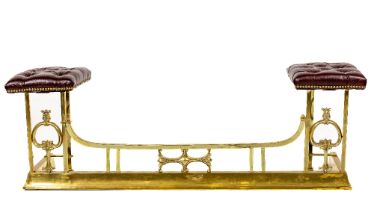 An Art Nouveau style brass club style Fender, with square tubular supports and rails each end with a