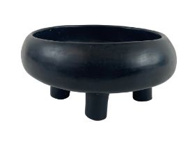 A rare South American black Pottery four legged Bowl, of circular ogee form, in the Pre-Columbian