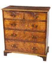 A Georgie III period mahogany Chest, of three long and two short drawers with rectangular moulded