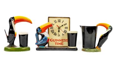 Advertisement: A porcelain painted Guinness Time Clock, decorated with Toucan and Pint, together