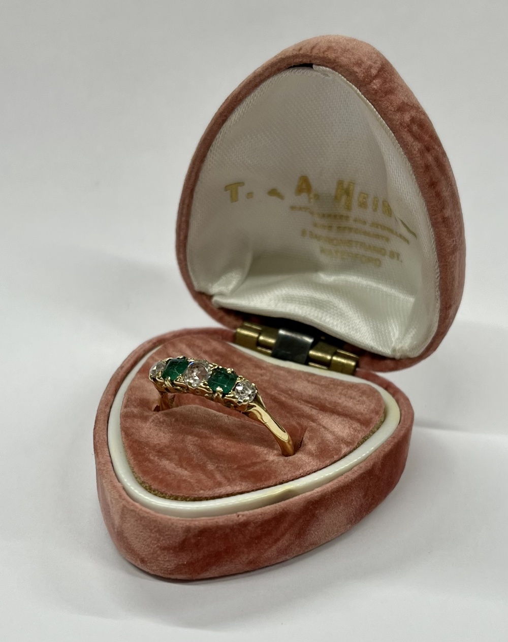 An attractive Ladies emerald and diamond Ring, the emeralds (.37ct x 2 = 1.1ct), the diamonds (.34ct