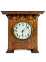 An Art Deco style oak Mantle Clock, with circular dial and Arabic numerals, 31cms x 28cms (12" x