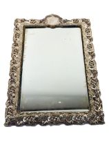 An attractive Art Nouveau period decorated silver framed Mirror, design with typical motifs, and