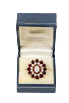 An attractive Ladies 9ct gold opal and red garnet Cluster Ring, (7.5g t.c.w.) 12 x 4.3mm round, size