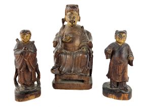 A late 19th Century carved soft wood Figure, of a seated Buddha with gilt face holding a vessel in