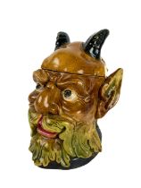 A rare Continental Majolica type Biscuit Barrel, modelled as a horned bearded figure, stamped with