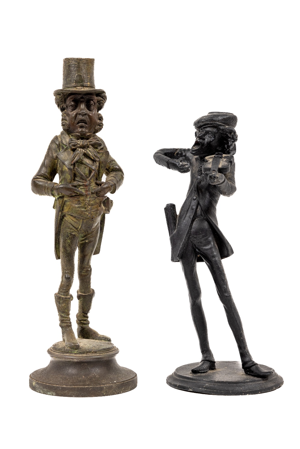 A Spelter model Candlestick, of Dickens Character, together with another similar metal