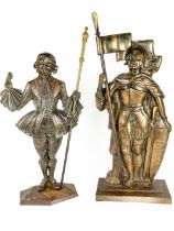 A bronzed cast iron Fire Tidy, in the form of a medieval Solider, holding a flag concealing a poker,
