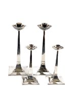 A very important and rare suite of 4 Arts & Crafts silver Candlesticks, by James Dixon & Sons,