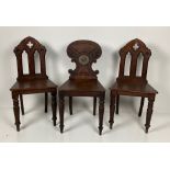 A William IV period mahogany Hall Chair, with shield shaped back with central painted crest above