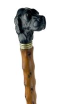 A rare 19th Century Gentleman's Swagger Stick, with ebonised and carved great dame head handle, with